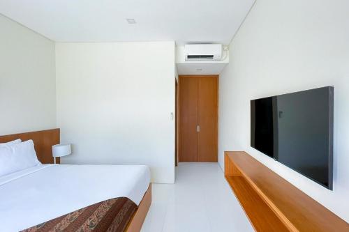 Televisyen dan/atau pusat hiburan di Aldan Guest House Syariah