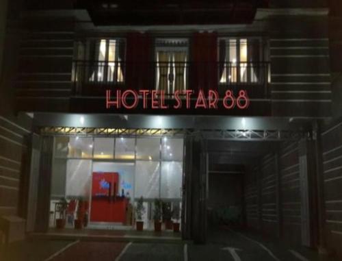 a hotel sign on the front of a building at Hotel Star 88 in Ngabean