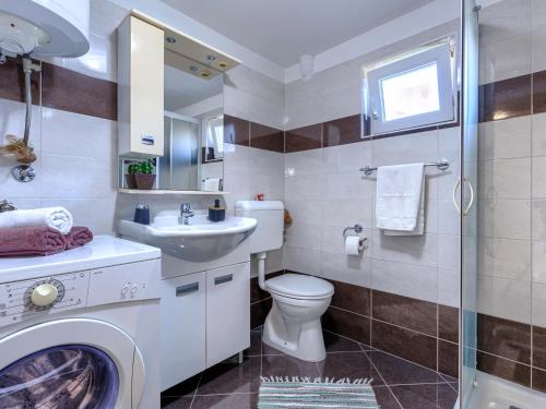 a bathroom with a toilet and a sink at Paola in Kršan