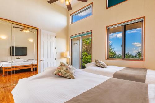 Postel nebo postele na pokoji v ubytování オーシャンビュー BBQ可能 最大15名 3寝室3バスルーム Nalu Mele Resort