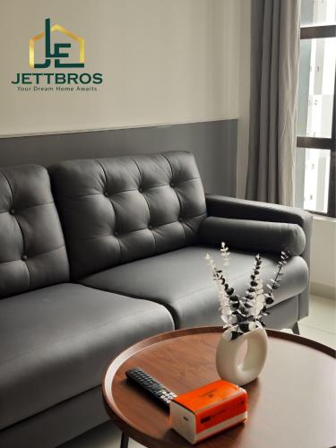 a living room with a couch and a table at D' Summit Residence By JettBros Johor Bahru in Johor Bahru