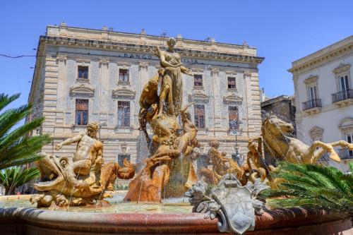 a water fountain in front of a building at Villa la Pineta in Arenella