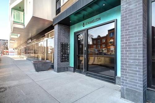 a store front of a building with a sign on it at Condo Old Quebec - Gym - AC - Indoor Parking - Rooftop in Quebec City