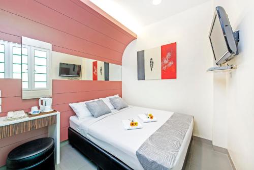 Postel nebo postele na pokoji v ubytování Hotel 81 Rochor