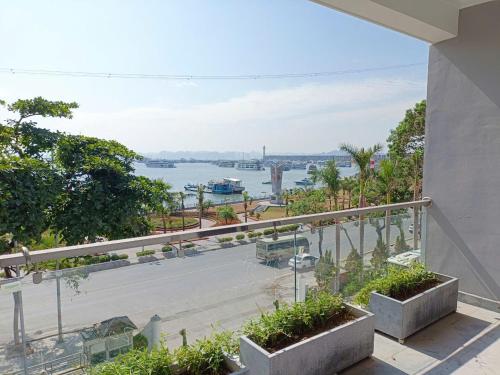 a view of the water from the balcony of a building at Bạch Đằng Hạ Long Hotel in Ha Long