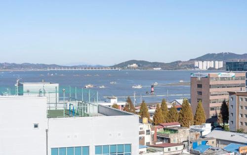 a view of a city with a large body of water at Rings Hotel in Gunsan