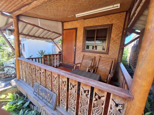 a porch of a house with chairs on it at Slumberland at Pai in Pai