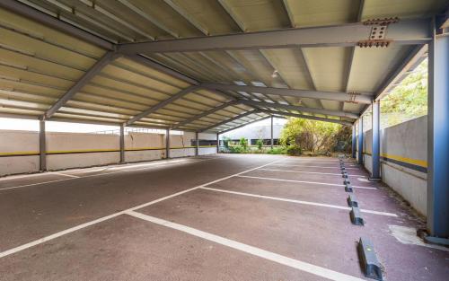 an empty parking lot in a parking garage at Rings Hotel in Gunsan