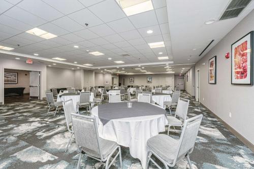 a conference room with a table and chairs at Hilton Garden Inn Charleston Airport in Charleston
