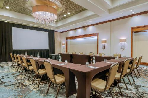 a conference room with a long table and chairs at Embassy Suites Houston - Downtown in Houston