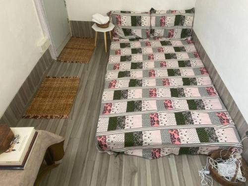 an overhead view of a bed in a room at Budget friendly Mini Heaven 2 in Kolkata