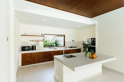 a kitchen with a sink and a counter at Luxury Villa Noah in Kuta