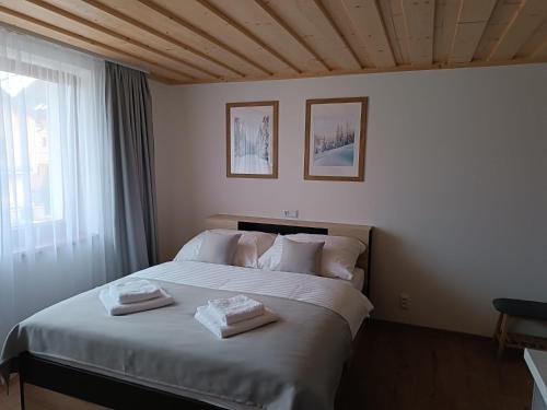 Postel nebo postele na pokoji v ubytování Apartmány pod Mníchom