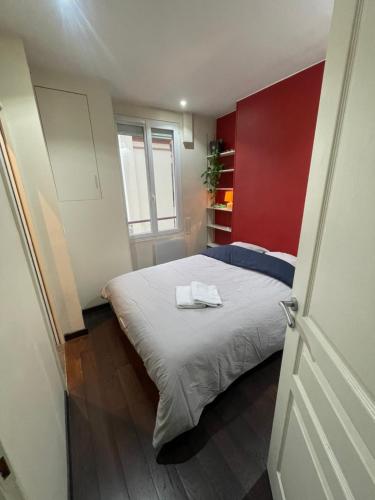 Un ou plusieurs lits dans un hébergement de l'établissement Cocon chaleureux & charmant - Nation