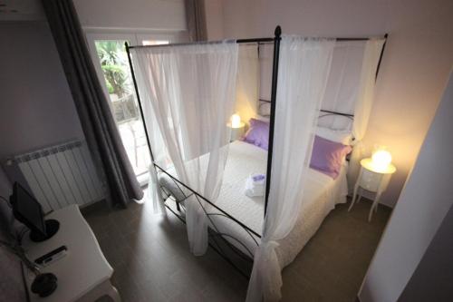 Postel nebo postele na pokoji v ubytování B&B Ai Tre Archi
