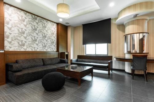 a living room with a couch and a table at OHYA Chain Boutique Motel-Xinying in Xinying