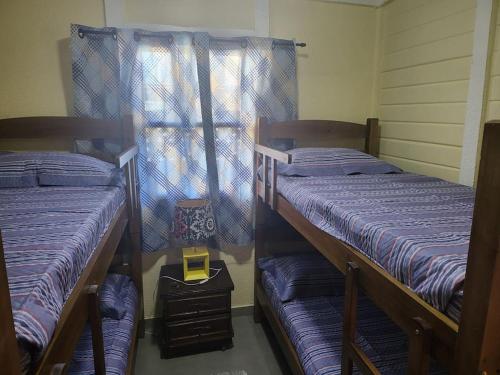 Ένα ή περισσότερα κρεβάτια σε δωμάτιο στο Casa Caminho das Dunas