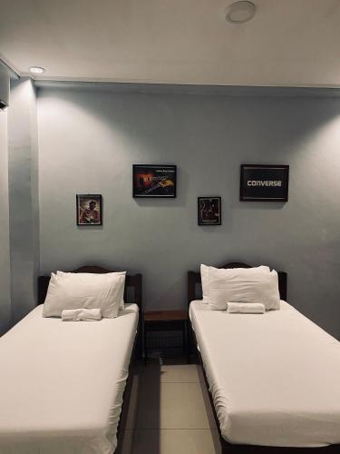 Ένα ή περισσότερα κρεβάτια σε δωμάτιο στο Lakayo Hillside Apartelle