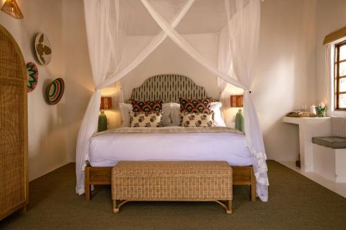 Una cama o camas en una habitación de Grays Eden Boutique Hotel