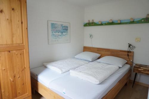 Postel nebo postele na pokoji v ubytování Kustverhuur, Park Schoneveld Duinroos 133