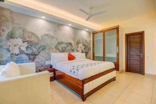 a bedroom with a bed and a floral wall at Golden Healing Journeys Homestay in Rishīkesh