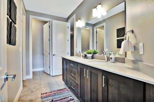 a bathroom with a sink and a large mirror at Entrada at Moab 620 in Moab