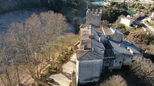 an aerial view of a large house with a tower at Château d'Esparron in Esparron-de-Verdon