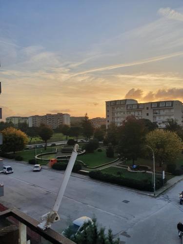 a large white object in a parking lot with buildings at Dc apartment in Santa Maria Capua Vetere