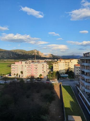 a view of a city with buildings and mountains at Dc apartment in Santa Maria Capua Vetere