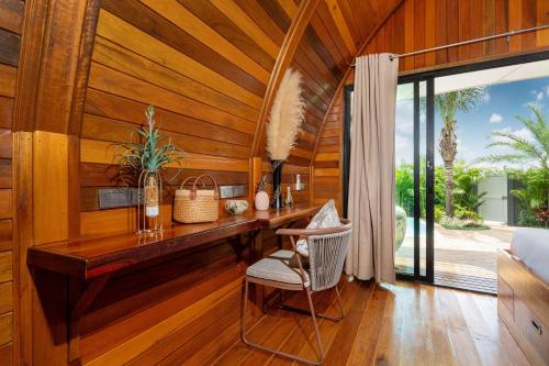 a room with a wooden wall with a desk and a chair at Tropical Chalet-Style 2BR Villa with Pool Pasak Paradise 2, Bangtao in Laguna Phuket