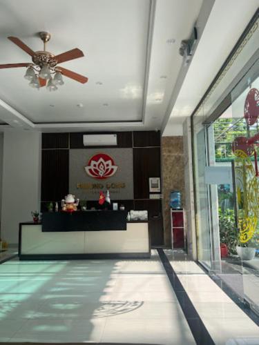 a lobby of a hotel with a ceiling fan at Phương Đông Hotel and Apartment in Hai Phong