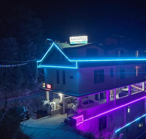 a house with neon lights on top of it at Aagaman Woods Homestay in Shimla