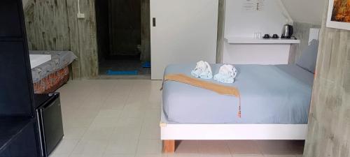 Ένα ή περισσότερα κρεβάτια σε δωμάτιο στο Cashewnut Tree Resort