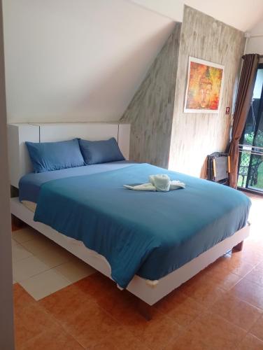 Ένα ή περισσότερα κρεβάτια σε δωμάτιο στο Cashewnut Tree Resort
