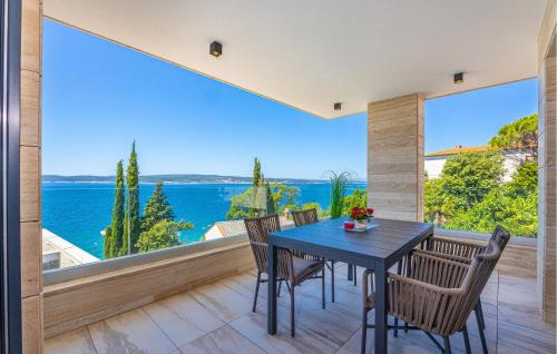 a dining room with a view of the ocean at Gorgeous Apartment In Crikvenica in Crikvenica