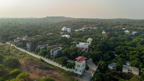 an aerial view of a city with trees and buildings at Le Casa Lion Resort A Premium Resort In Sasan Gir in Sasan Gir
