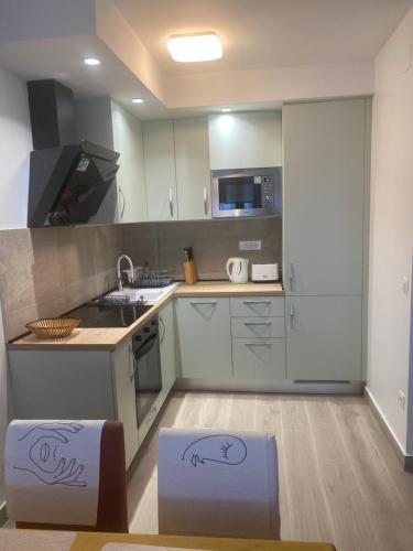 a kitchen with two boxes sitting on the floor at Apartment Amalfi in Split