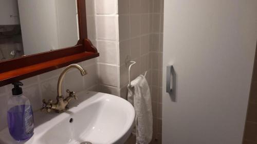 a bathroom with a white sink and a mirror at La Vía Verde in Jérica