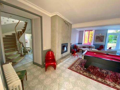 a living room with a pool table and a living room at Clos Minotte 30 pers jacuzzi, billard, baby-foot in Tessy-sur-Vire