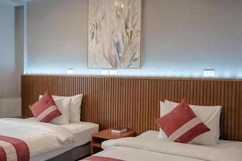 Postel nebo postele na pokoji v ubytování Kekehyu Business Hotel