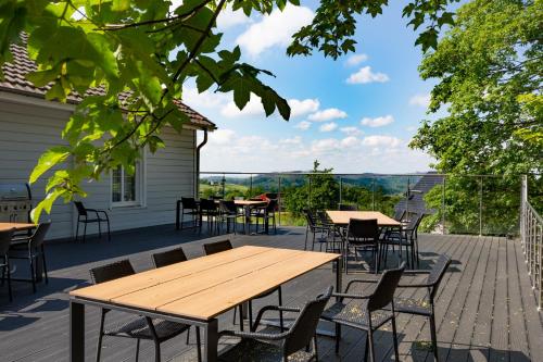 a wooden table and chairs on a patio at Lieblingsquartier Sankt Andreasberg Studio 9 in Sankt Andreasberg