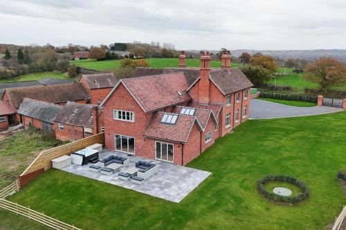 an aerial view of a large brick house at Grange House - Sleeps 24 in Alvechurch