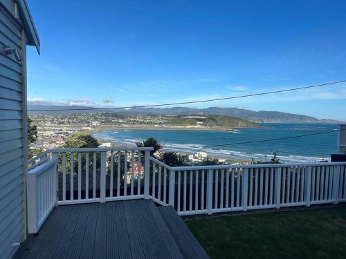 a balcony of a house with a view of the ocean at Views for day's in Lyall Bay in Wellington