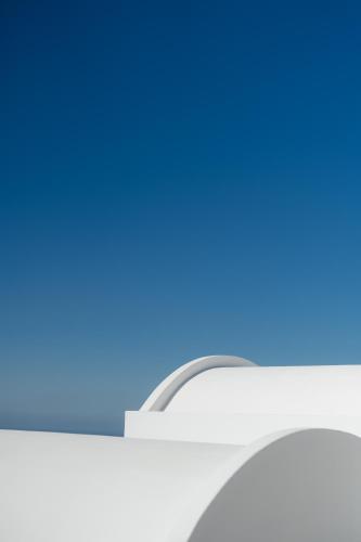 a close up of a computer keyboard with a blue at Santorini Princess Spa Hotel in Imerovigli