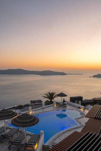 a view of the pool atilon beach hotel resort at Santorini Princess Spa Hotel in Imerovigli