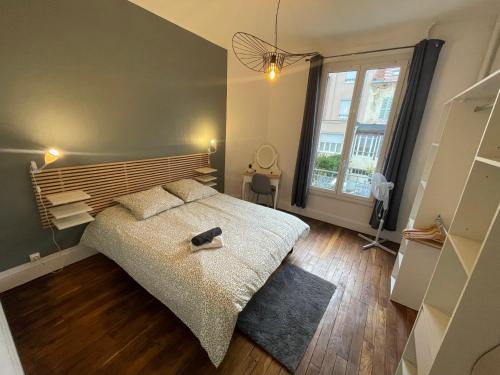 Ένα ή περισσότερα κρεβάτια σε δωμάτιο στο Émeraude 2