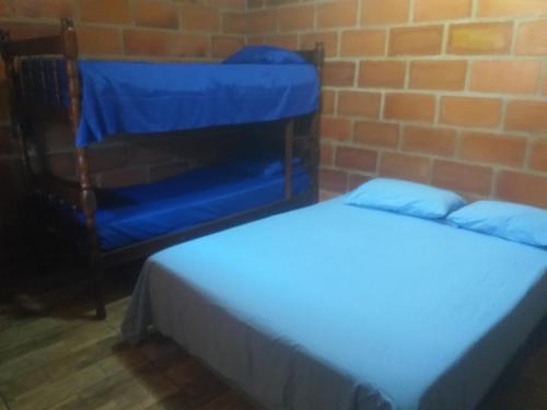 Postel nebo postele na pokoji v ubytování Chácara Rancho do Lago