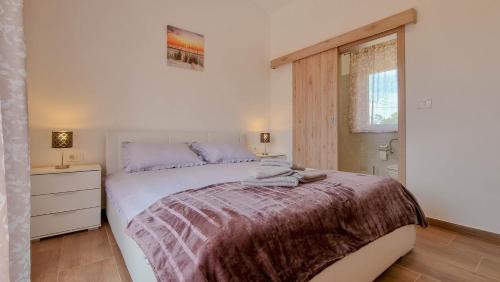 Postel nebo postele na pokoji v ubytování Casa Dorjana