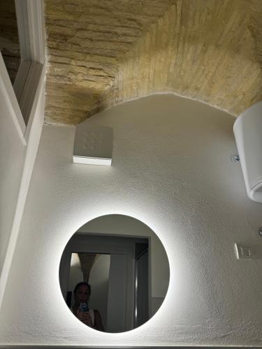 a man taking a picture of himself in a mirror at Residenze Le Lunette in Lucera