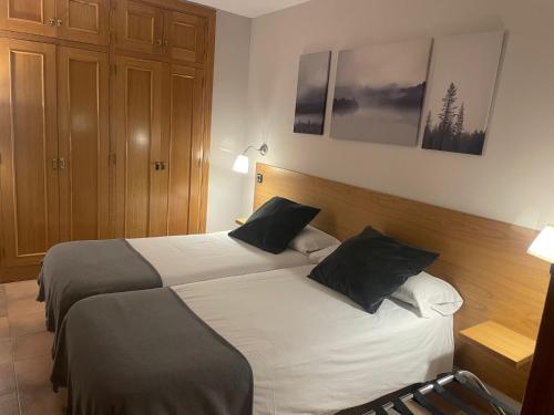 Postel nebo postele na pokoji v ubytování Aparthotel El Serch
